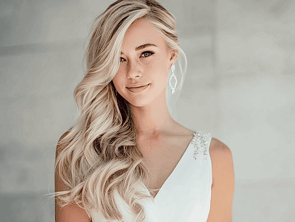 Bride with long hair styled for wedding, glamorous bridal hairstyle