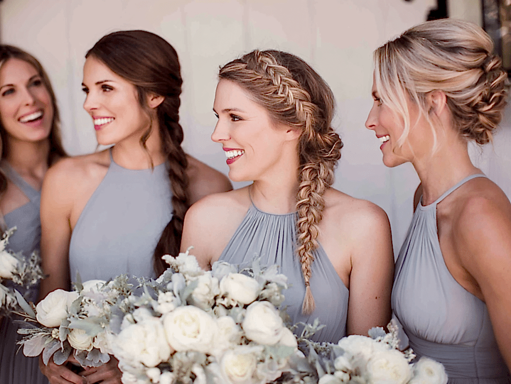 Bridesmaid with braided hairstyle, coordinated wedding party look